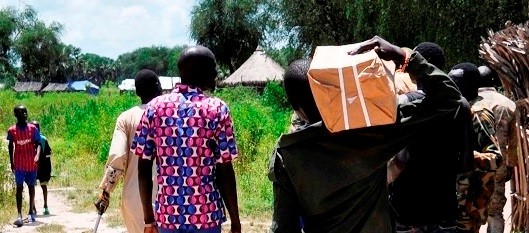 SPLA-IO soldiers carry boxes with forms delivered by JMCC members to register forces in Ayod County on September 24, 2019. (Photo: Radio Tamazuj)