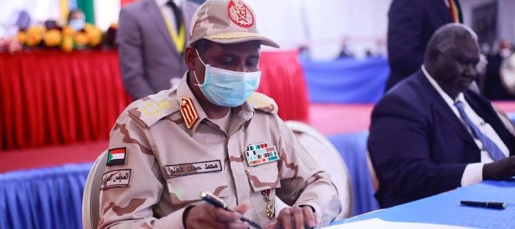 A file picture shows Sudanese paramilitary commander Mohamed Hamdan Daglo signing the peace deal document between the government and the rebel groups in Juba, South Sudan, on August 31. (AFP)