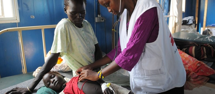 Clinical officer Maureen Akenga treats a child that was admitted to MSF's field hospital in Doro refugee camp in Maban county with severe malaria.