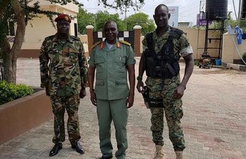 File photo: Lual Akeen (Right) standing with former army chief Paul Malong (middle). (Radio Tamazuj)