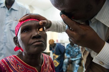 Eye surgeon examines a patients eyes at Lui Hospital. Photo: MAF