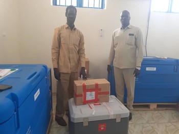 Unity State caretaker minister of health Stephen Tot Chieng and Dr. Banen medical director in Bentiu Hospital standing next to the J&J vaccines. [Photo: Radio Tamazuj]