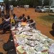 NSS displays seized fake currency, arrested suspects at the NSS Security Division in Juba on Thursday 04, November 2021. [Photo: South Sudan]